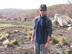 Dave Hunter, a corroboree frog researcher, visits a severely damaged breeding area. Copyright Amphibian Research Centre. Photograph by Gerry Marantelli.